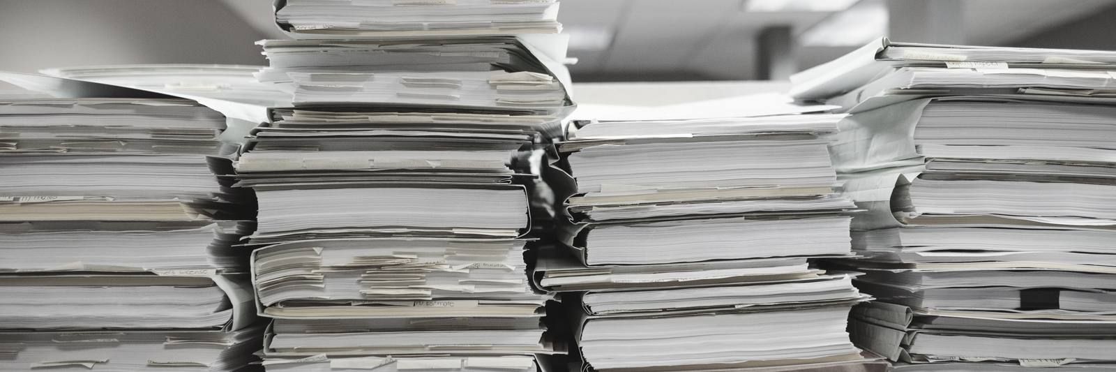 Stacks of folders and cardboard files